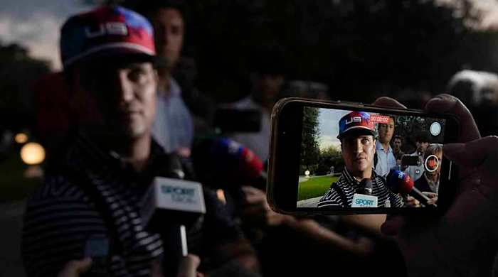 U.S. Ryder Cup team captain Zach Johnson talks to reporters as he returns with members of his team at a hotel in Rome, Friday, Sept. 8, 2023, at the end of a practice session at the Marco Simone golf club where the 2023 Ryder Cup will be held.
